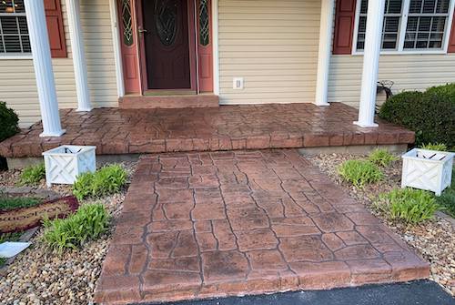 stamped concrete front porch with large steps 